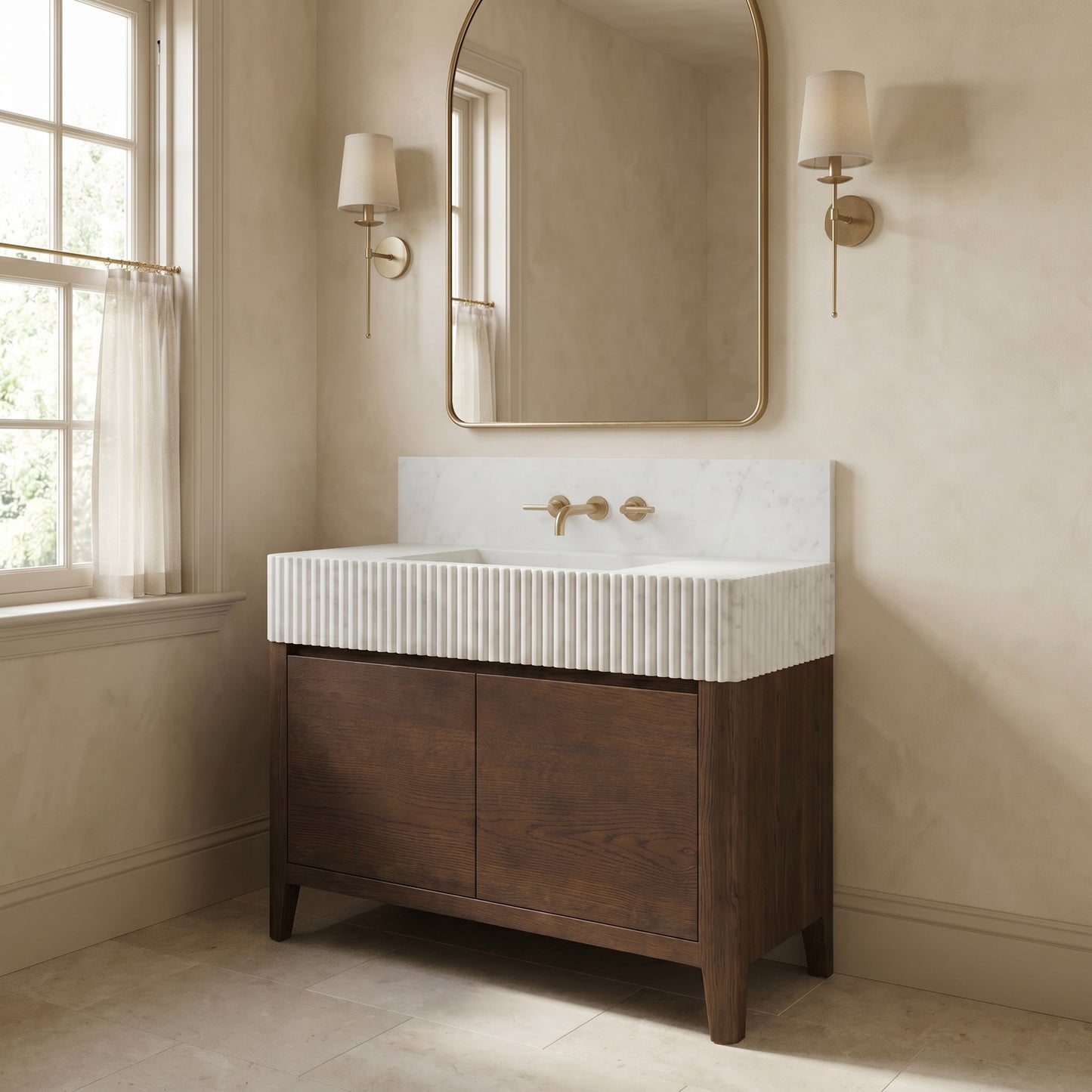 Custom Carrara marble bathroom vanity with hand carved fluted sink, matching backsplash and walnut cabinet