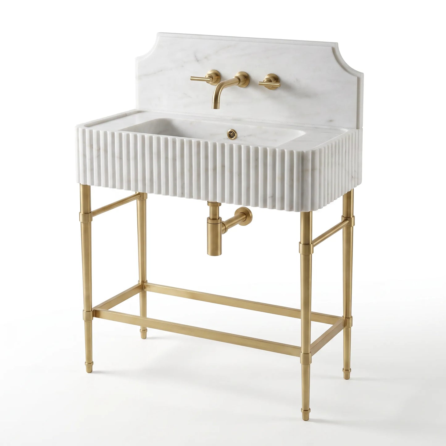 A freestanding rectangular sink vanity with a white marble-look front, fluted vertical detailing, a matching backplate, and a gold-tone metal stand and faucet hardware, shown on a clean white background.