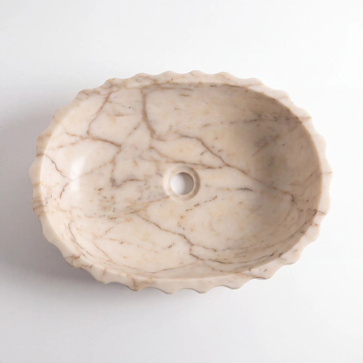 Detailed view of RMD-002 Aurevanta Calacatta Gold marble vessel sink showing elegant golden veining