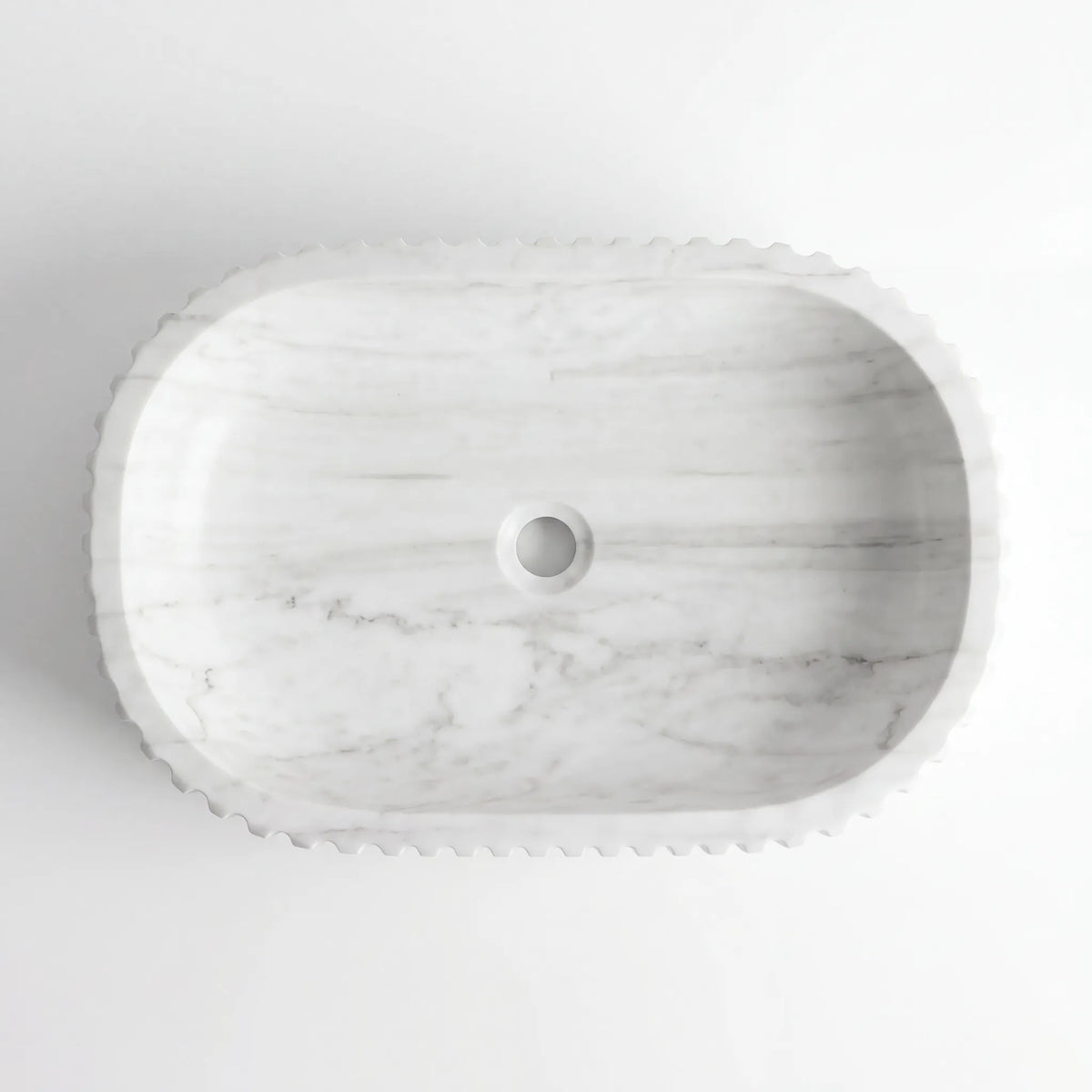 Detailed view of RMD-012 Carravena Carrara white marble vessel sink showing soft natural veining
