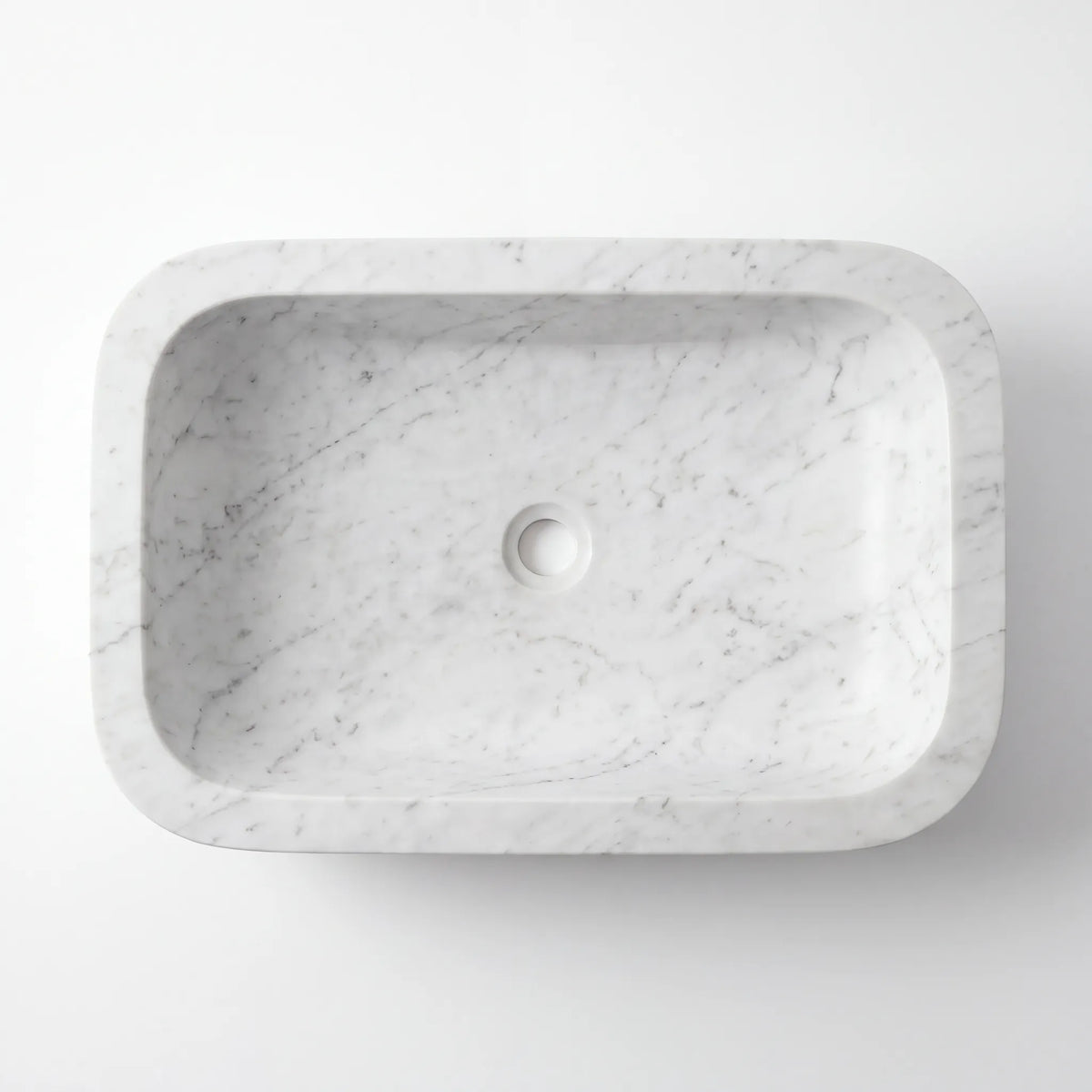 Detailed view of RMD-015 Carravelle Carrara white marble vessel sink showing soft natural veining