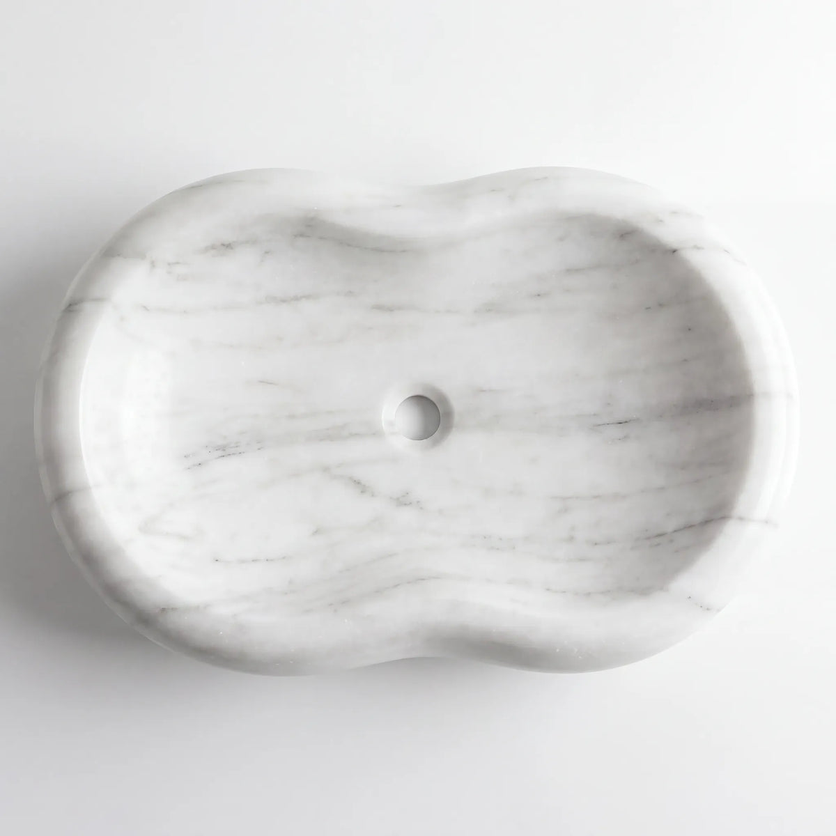 Detailed view of RMD-056 Carravena Carrara white marble vessel sink showing soft natural veining