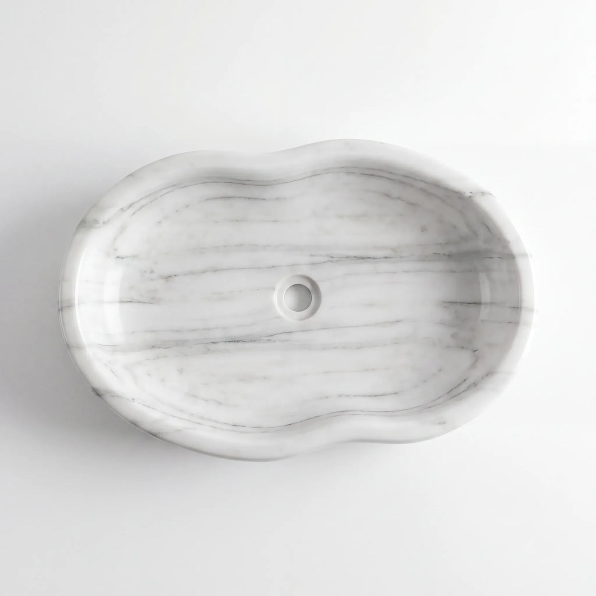 Detailed view of RMD-059 Carralisse Carrara white marble vessel sink showing soft natural veining