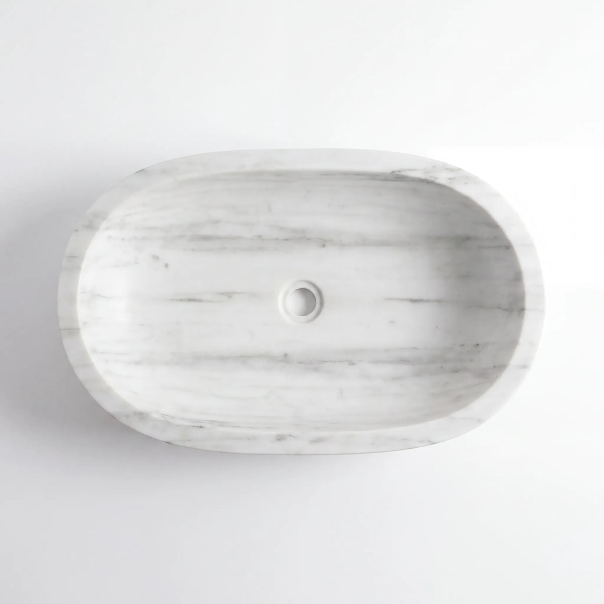 Detailed view of RMD-134 Carravelle Carrara white marble vessel sink showing soft natural veining