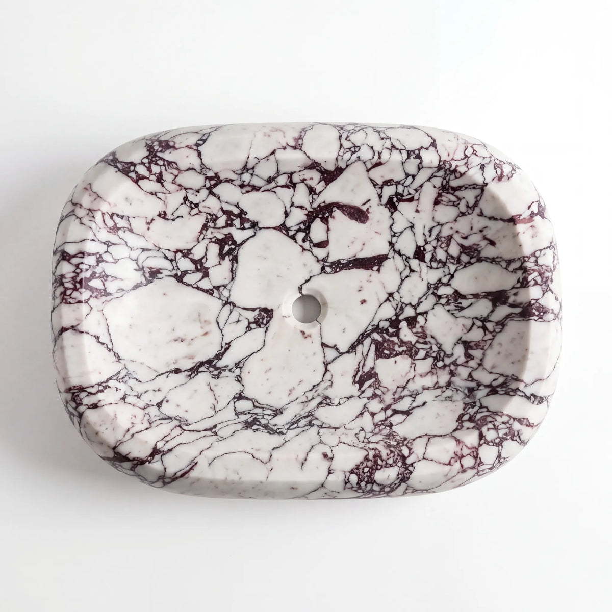 Detailed view of RMD-160 Violara Calacatta Viola marble vessel sink showing dramatic natural veining