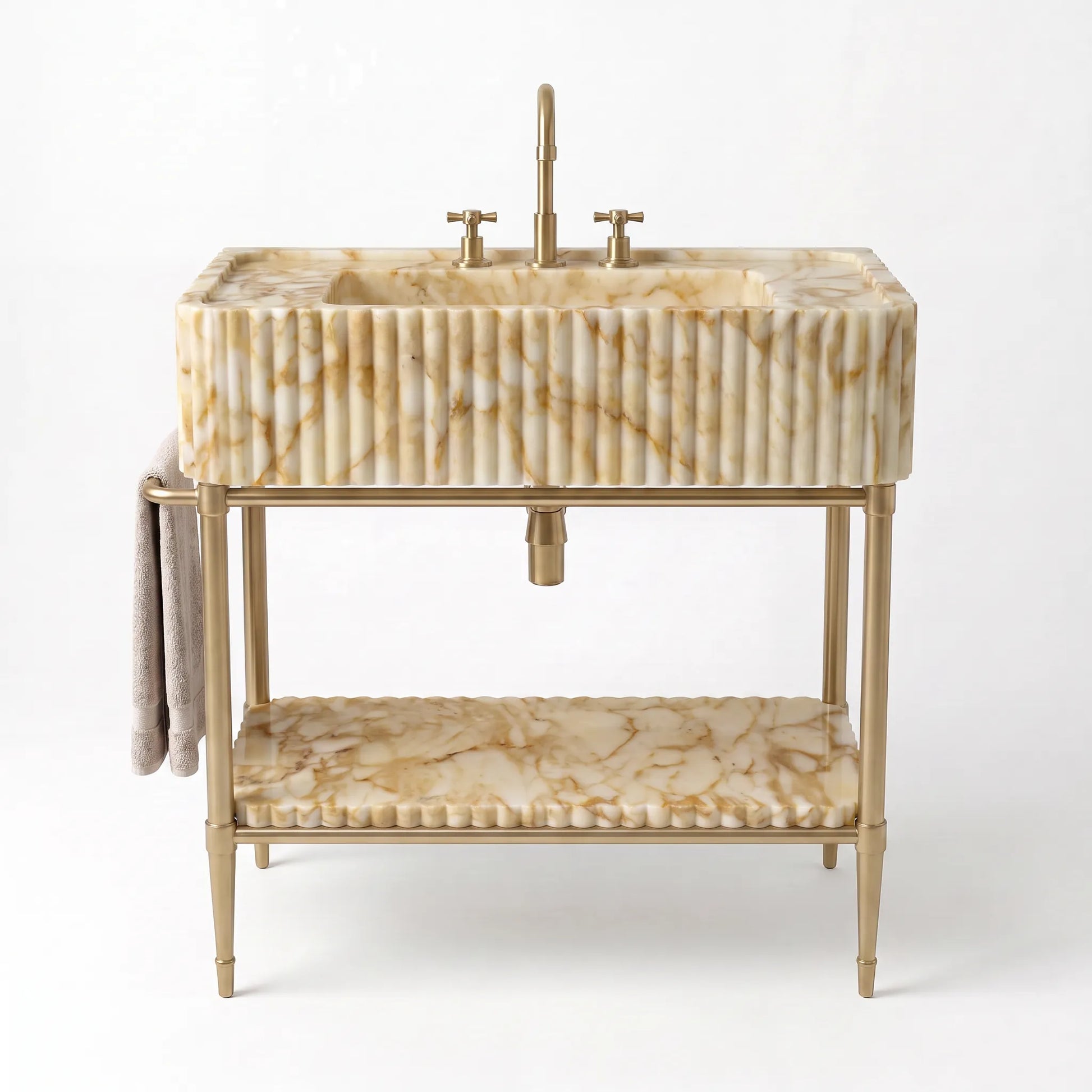 A freestanding vanity sink with a rectangular fluted marble basin in warm cream and tan tones, a matching lower shelf, and a gold-tone metal frame and faucet, shown on a clean white background.
