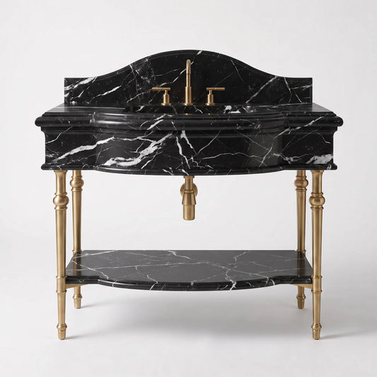 A classic-style bathroom vanity featuring a black marble sink top and matching lower shelf, supported by ornate gold-tone legs and accented with a gold faucet and handles, set against a light gray background.