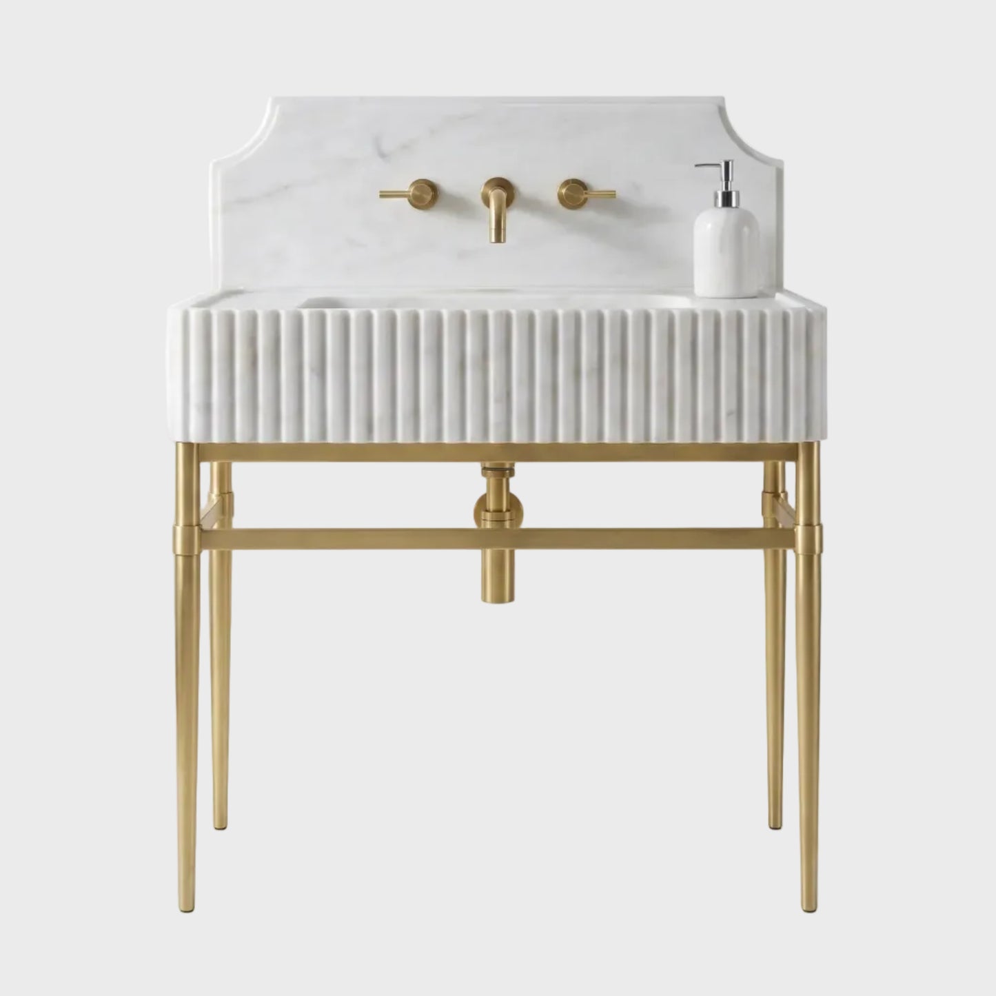 A modern bathroom vanity featuring a white marble sink basin with fluted detailing, a white marble backplate, and a gold-finished metal frame and faucet fixtures, shown on a clean white background.