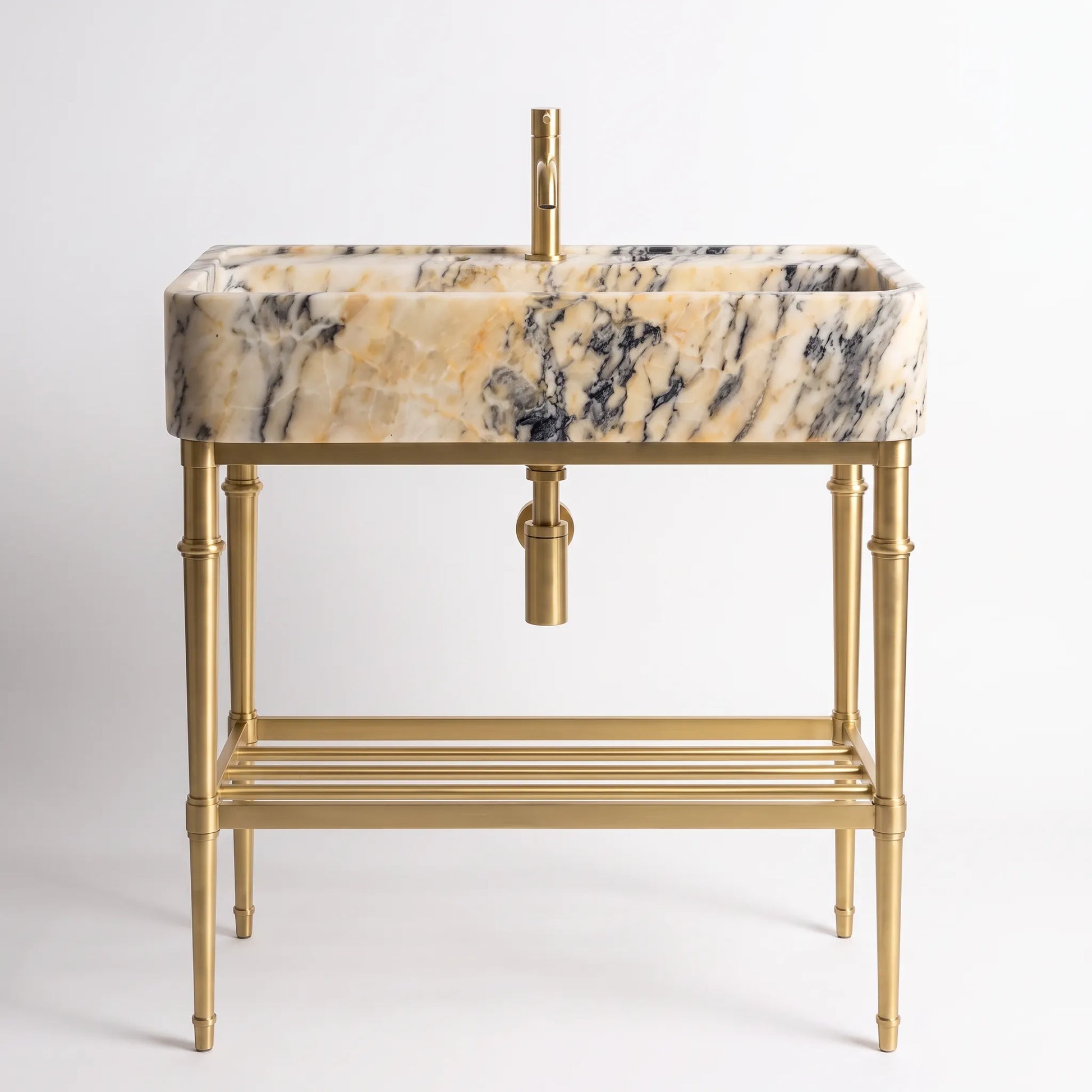 A modern bathroom vanity set featuring a rectangular basin with a beige, cream, and black marble pattern, supported by a polished gold brass stand with a bamboo-inspired leg design and a lower shelf.