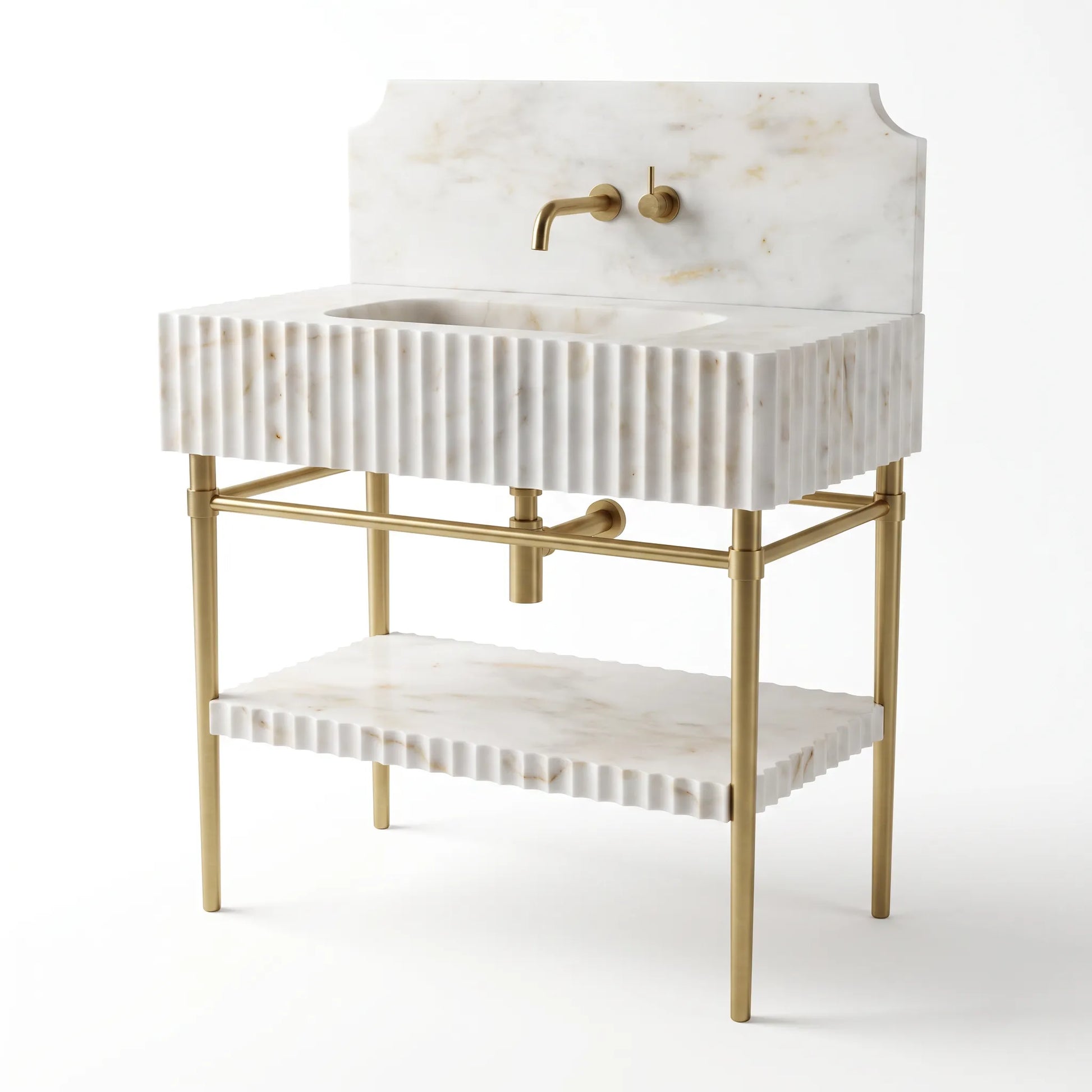 A modern bathroom vanity with a white marble sink and backplate featuring vertical fluting, supported by a gold-finished metal frame with an open lower shelf.