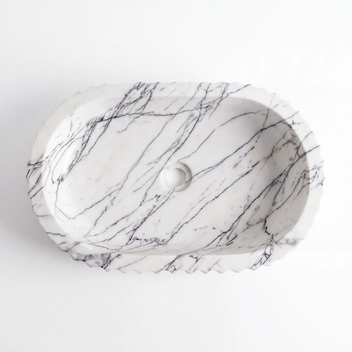Detailed view of RMD-001 Lilavena Lilac marble vessel sink showing distinctive natural veining
