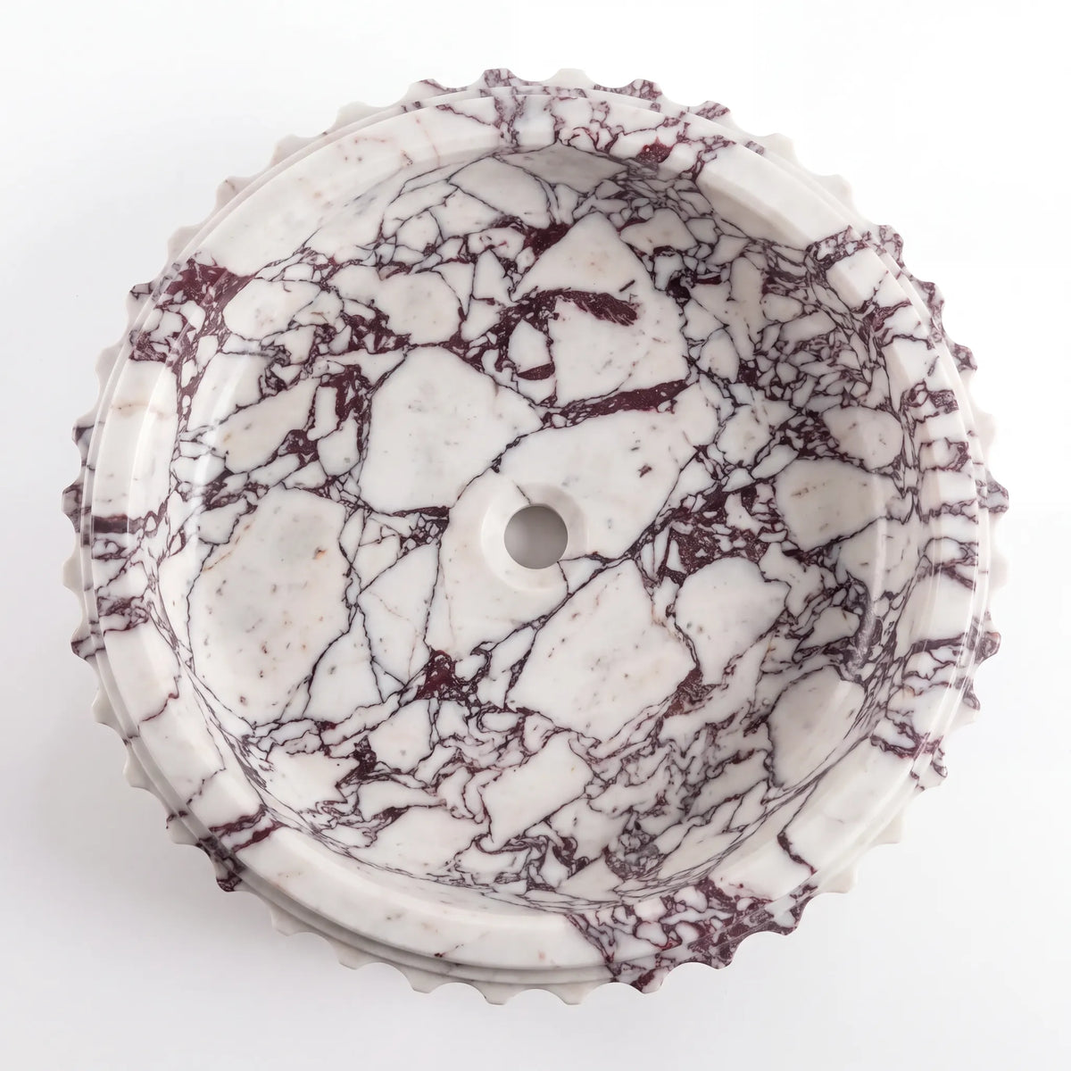 Detailed view of RMD-022 Violavora Calacatta Viola marble vessel sink showing dramatic natural veining