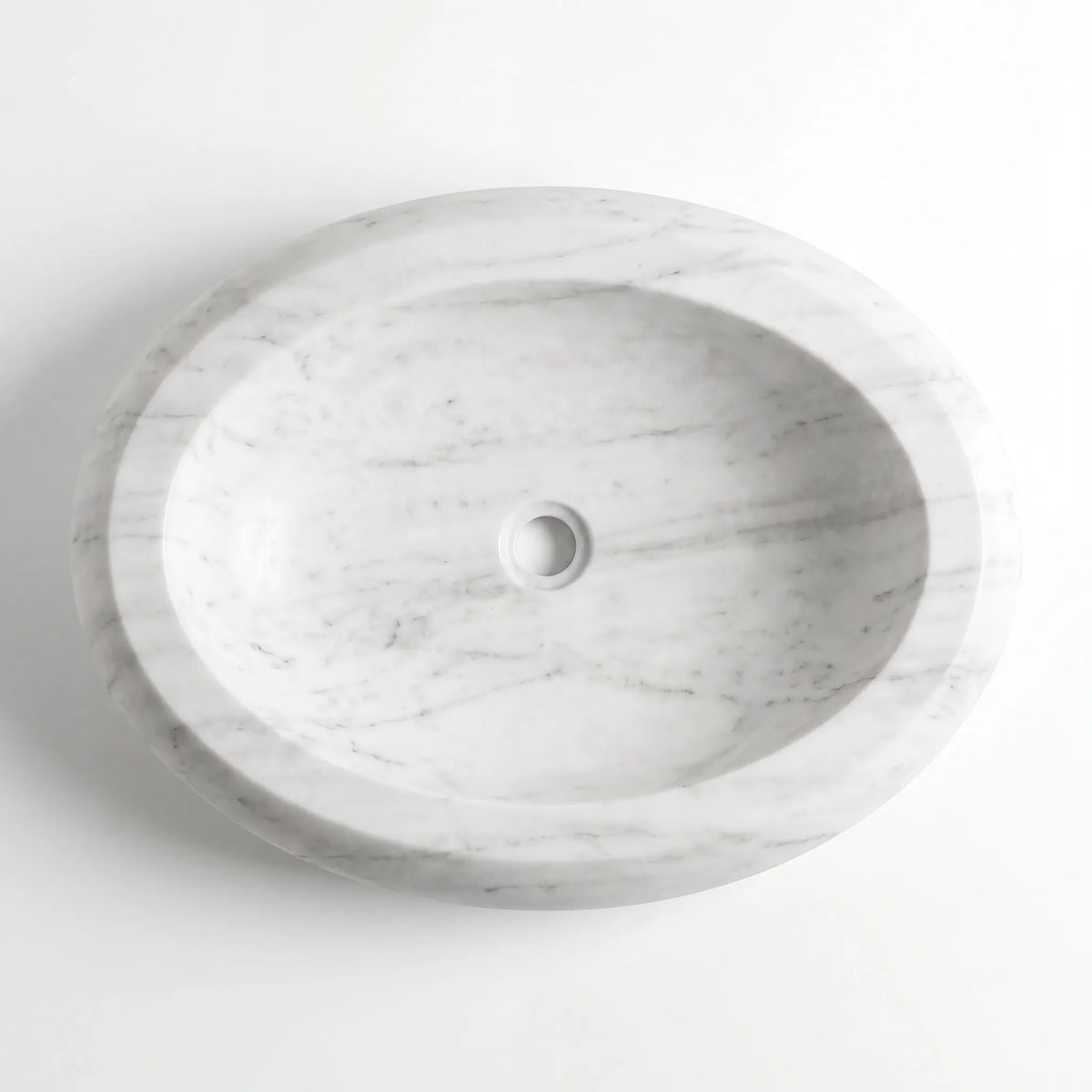 Detailed view of RMD-024 Carravissa Carrara white marble vessel sink showing soft natural veining