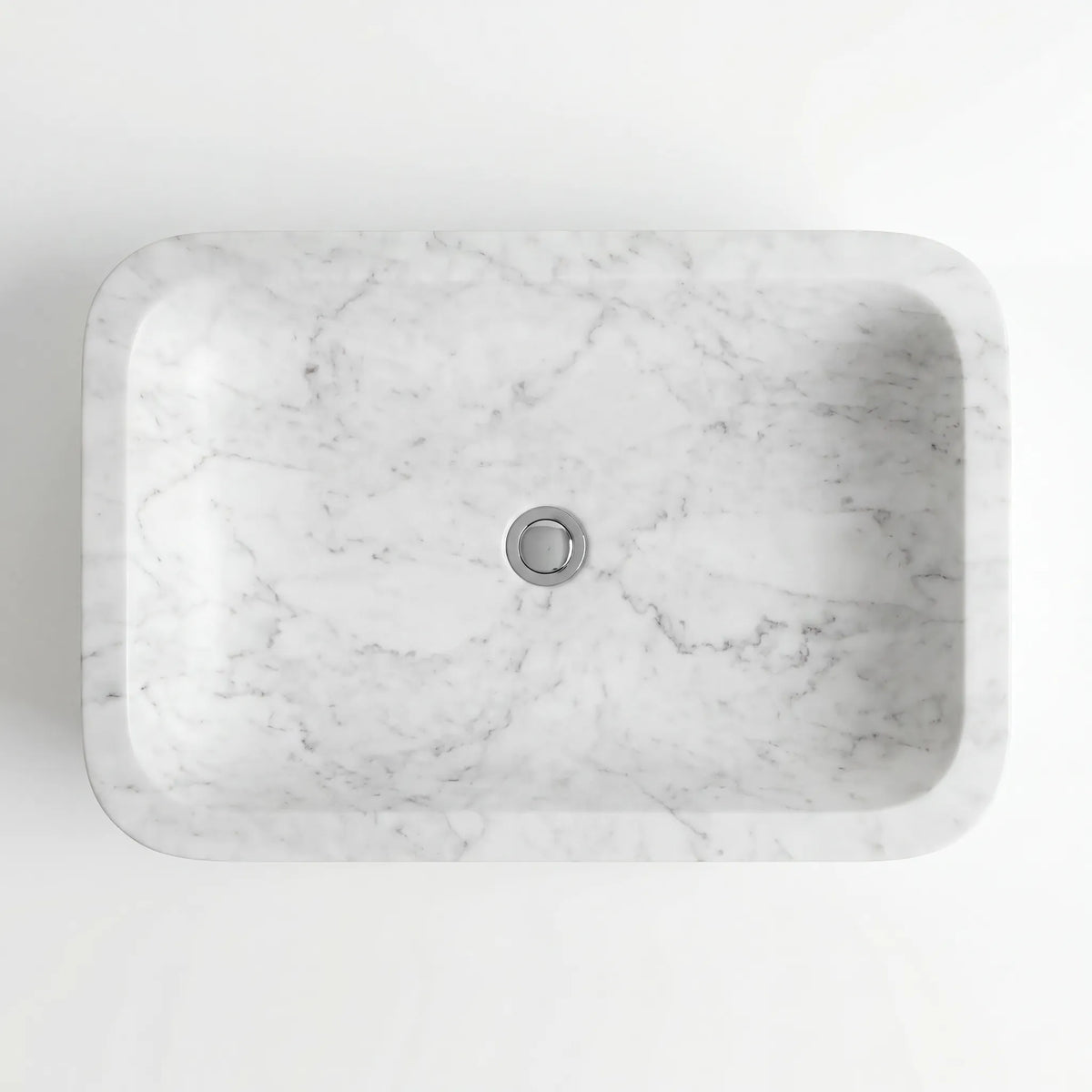 Detailed view of RMD-025 Carravelle Carrara white marble vessel sink showing soft natural veining