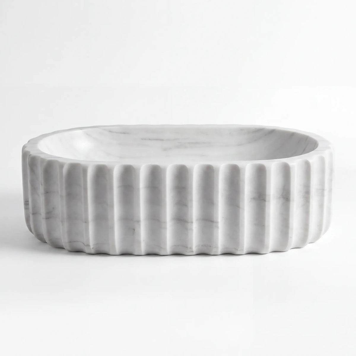 Front view of RMD-053 Carravante rectangular Carrara white marble vessel sink with polished finish