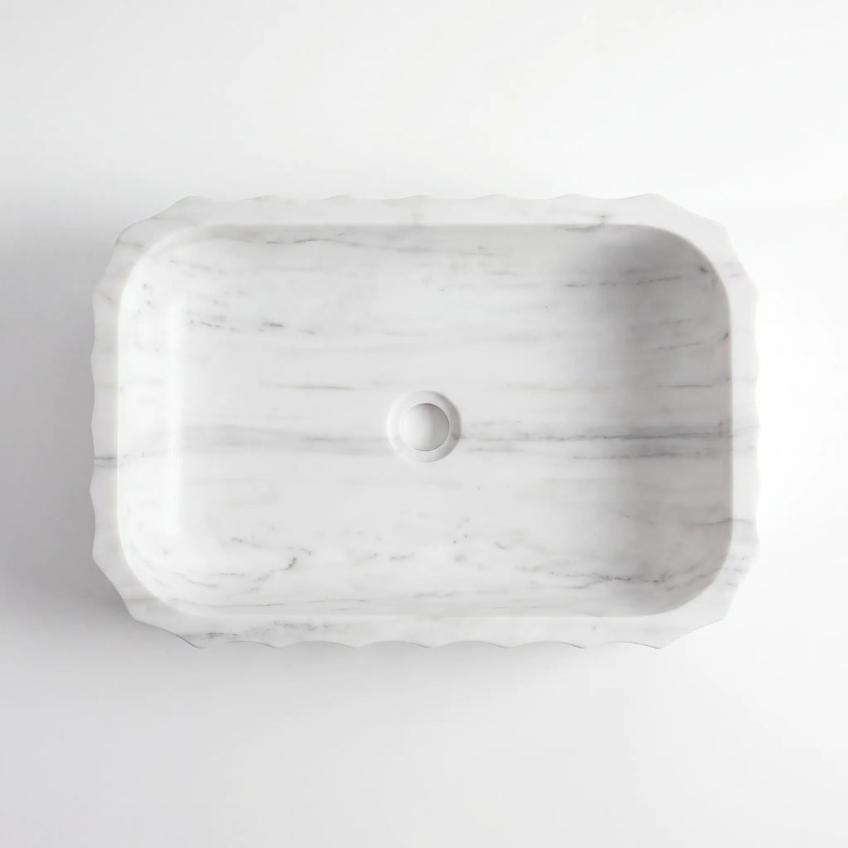 Detailed view of RMD-061 Carravere Carrara white marble vessel sink showing soft natural veining