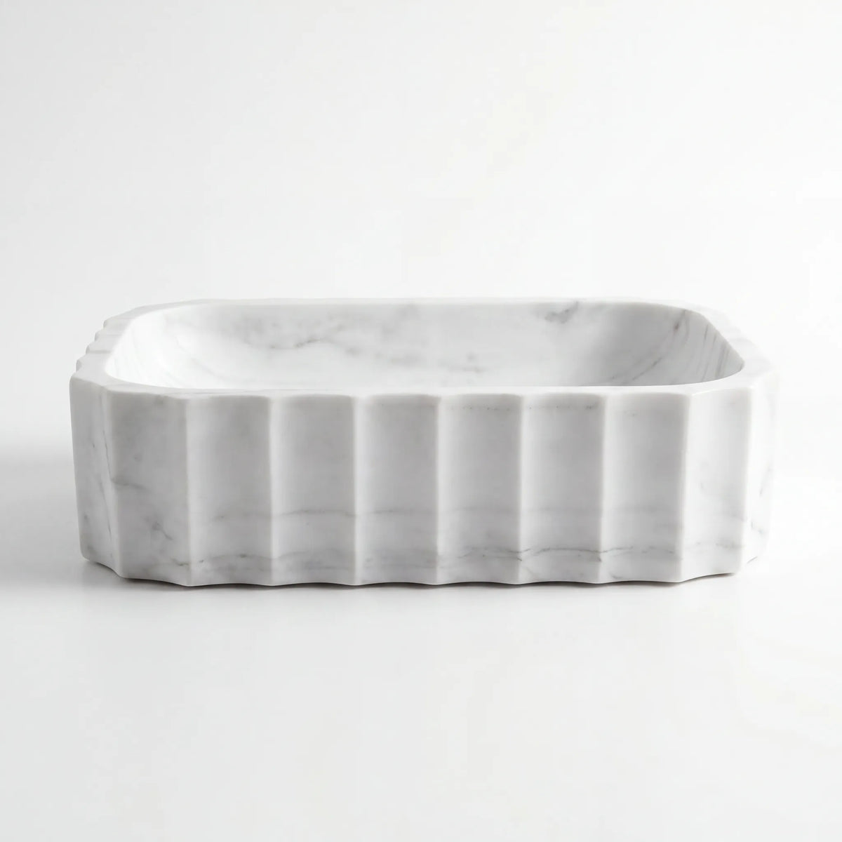 Front view of RMD-061 Carravere rectangular Carrara white marble vessel sink with polished finish
