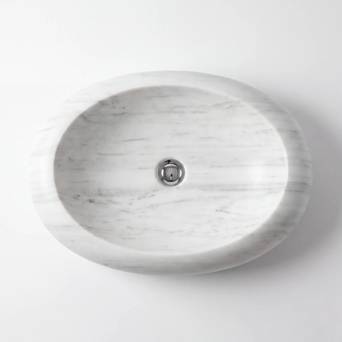 Detailed view of RMD-082 Carraluna Carrara white marble vessel sink showing soft natural veining