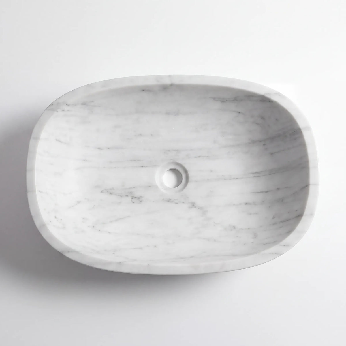 Detailed view of RMD-096 Carravessa Carrara white marble vessel sink showing soft natural veining