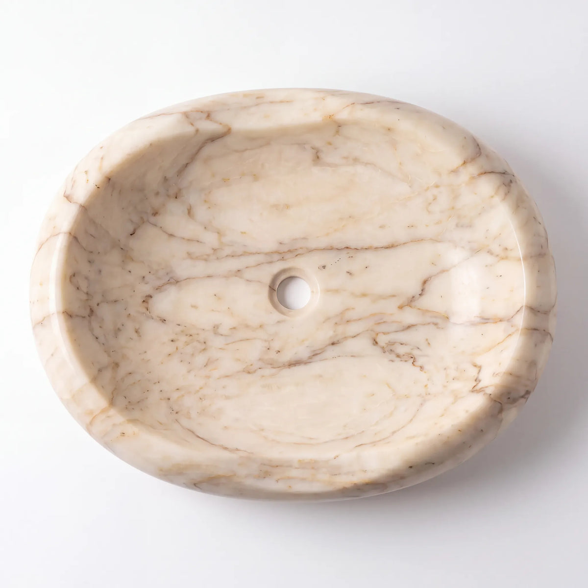 Detailed view of RMD-104 Aurelia Calacatta Gold marble vessel sink showing elegant golden veining