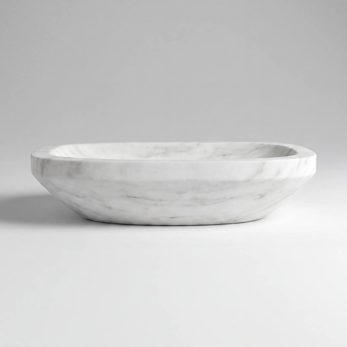 Front view of RMD-112 Carravienne round Carrara white marble vessel sink with polished finish