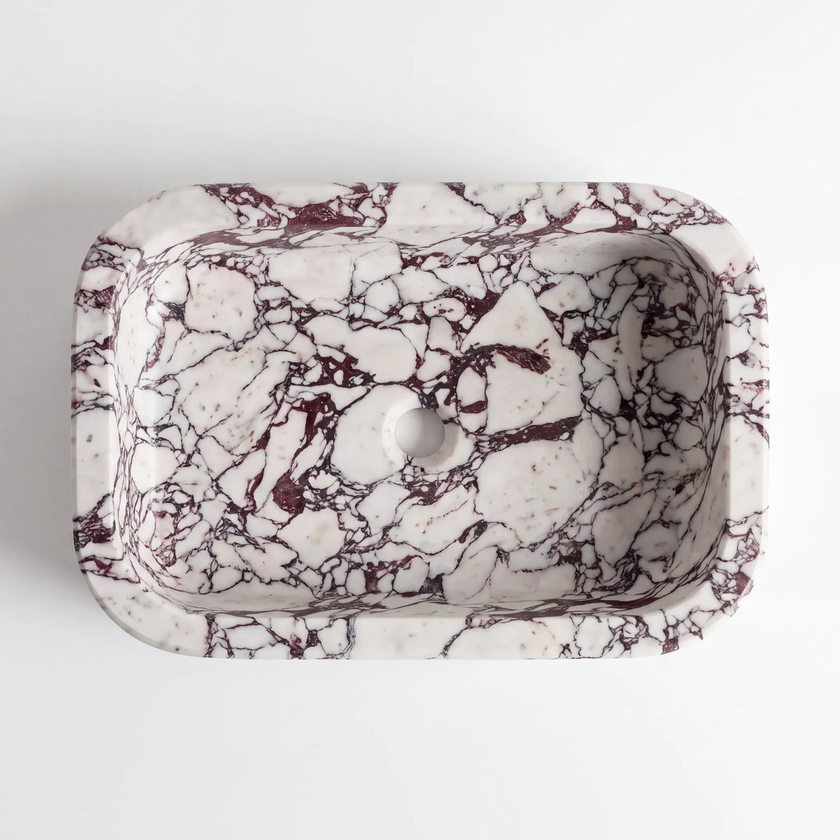 Detailed view of RMD-128 Viomara Calacatta Viola marble vessel sink showing dramatic natural veining
