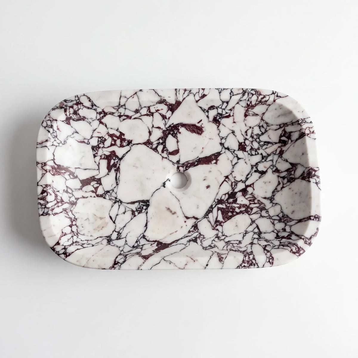 Detailed view of RMD-135 Violara Calacatta Viola marble vessel sink showing dramatic natural veining