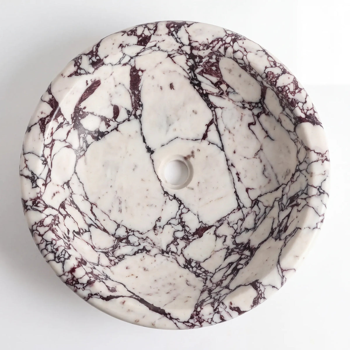 Detailed view of RMD-165 Viorella Calacatta Viola marble vessel sink showing dramatic natural veining