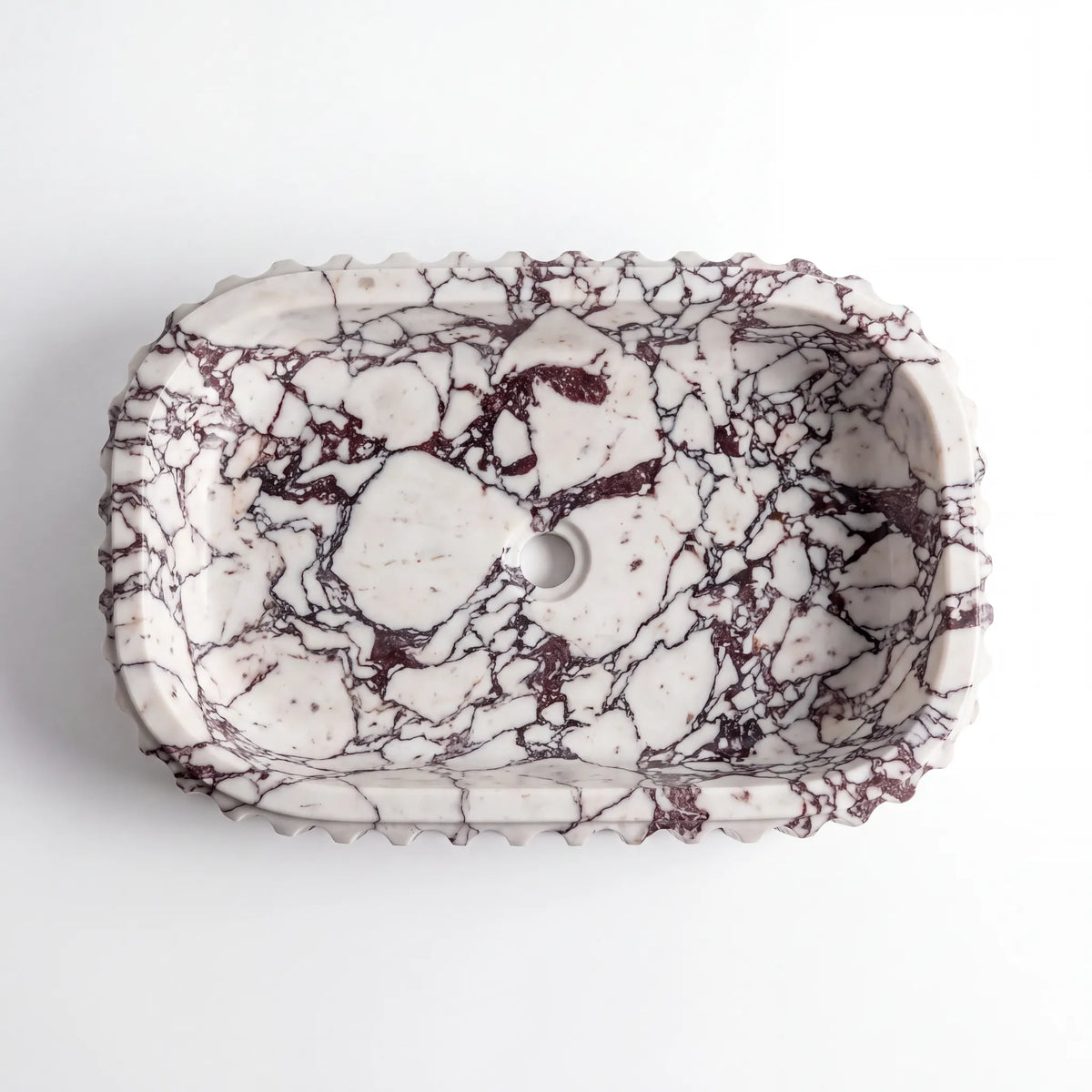 Detailed view of RMD-187 Vioretta Calacatta Viola marble vessel sink showing dramatic natural veining