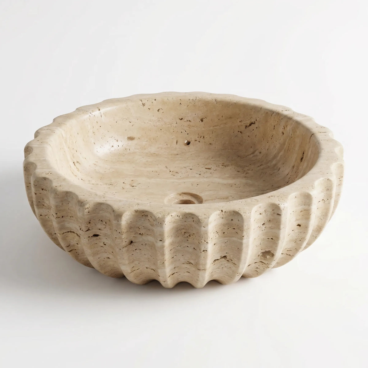 Detailed view of RMD-219 Tivara vessel sink showing distinctive natural travertine texture