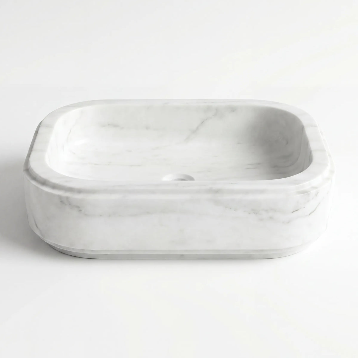 Detailed view of RMD-224 Carravelle Carrara white marble vessel sink showing natural stone veining