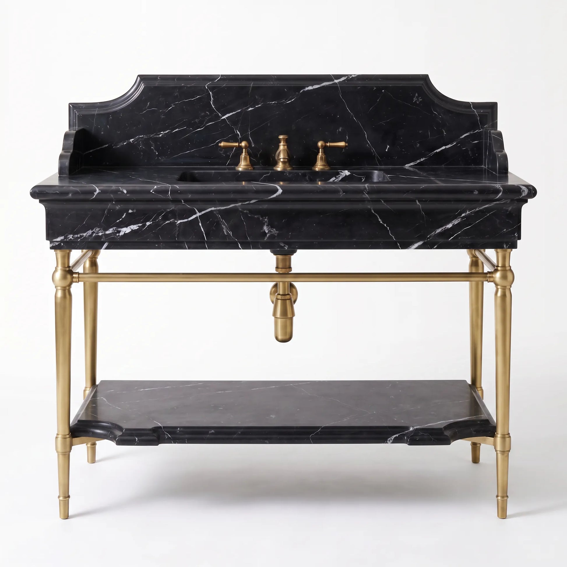 A vintage-style double-sink vanity featuring a black marble top and back panel with white veining, supported by an ornate brass frame with a lower shelf, set against a plain white background.