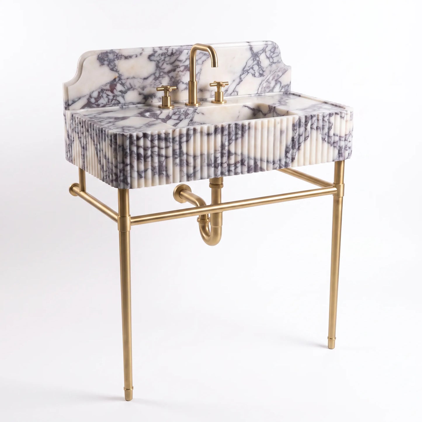 A modern bathroom vanity sink with a white and gray marble-patterned basin and backplate, supported by a gold-finished metal stand with a curved faucet and two-handle fixture.