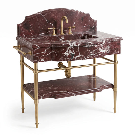 A vintage-style bathroom vanity featuring a deep red marble sink top and matching marble shelf, supported by a polished brass frame with a matching faucet and handles.