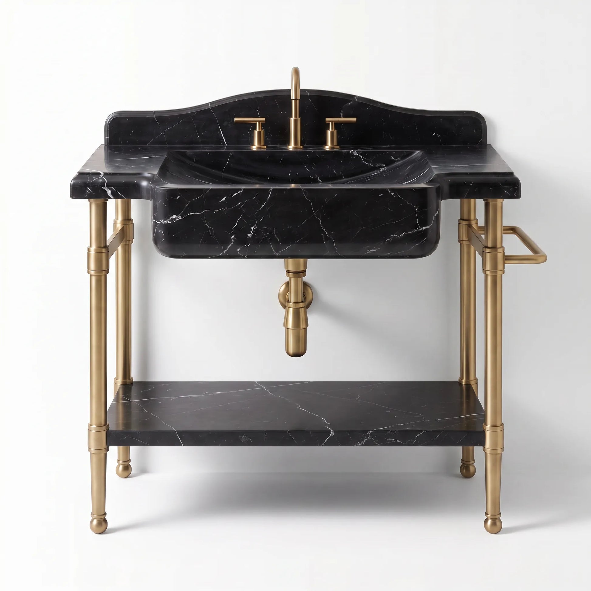 A freestanding bathroom vanity with a black marble countertop and sink, black marble shelf, and brass/gold metal legs, faucet, and handles on a light gray background.