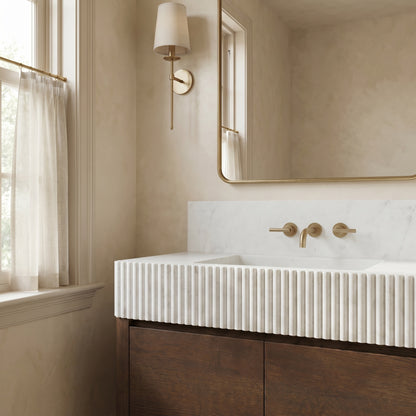 Alderley Carrara marble bathroom vanity with solid block fluted sink, backsplash and handcrafted walnut cabinet