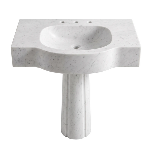 Avelin custom Carrara White marble pedestal bathroom sink with thick sculpted curved front, integrated basin, three faucet holes and rounded pedestal base