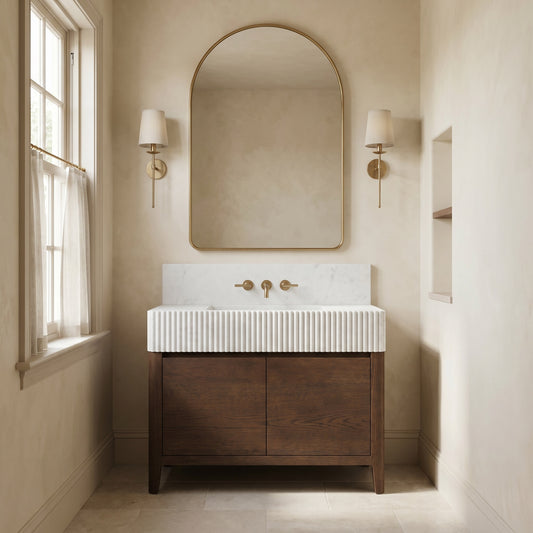Custom Carrara White marble bathroom vanity with fluted integrated sink, marble backsplash and walnut cabinet