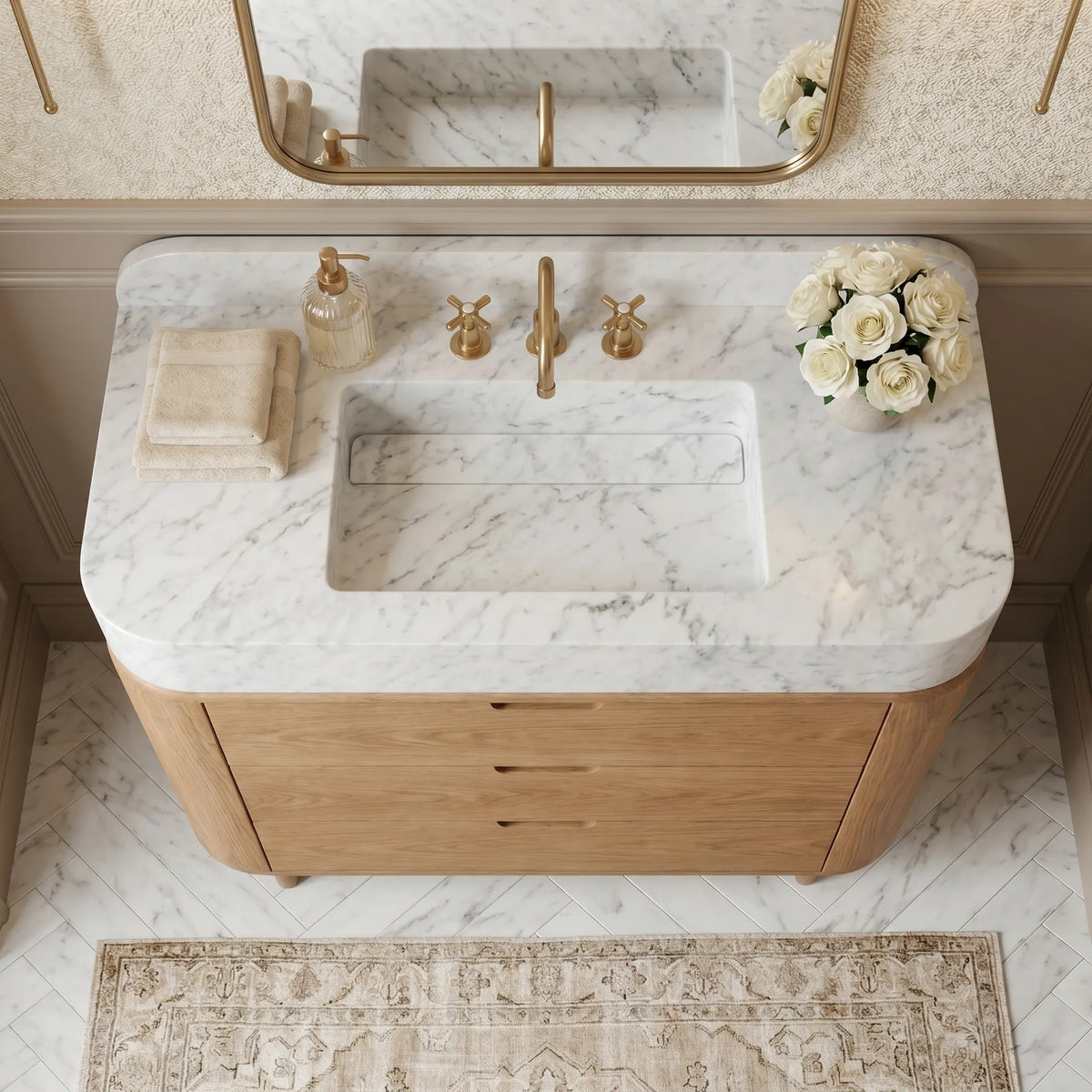 Carrara White marble bathroom vanity with integrated sink, matching backsplash and natural oak cabinet