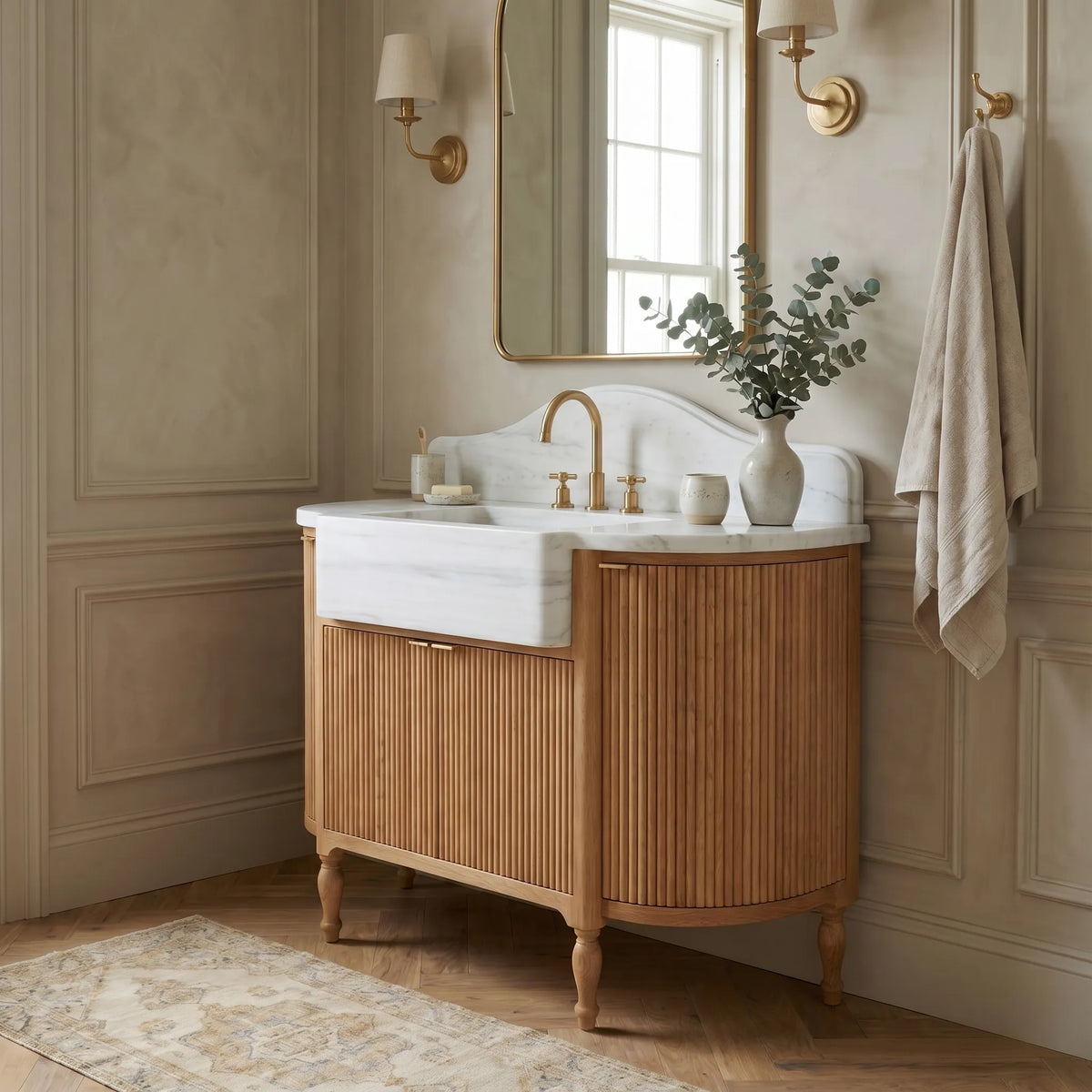 Custom Carrara marble bathroom vanity with sink carved from a single solid block and scalloped marble backsplash