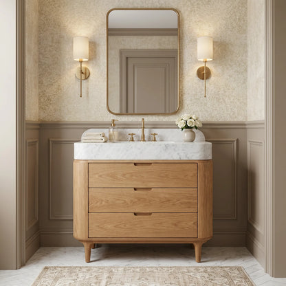 Custom Carrara White marble bathroom vanity with single-block sink, backsplash and handcrafted oak cabinet