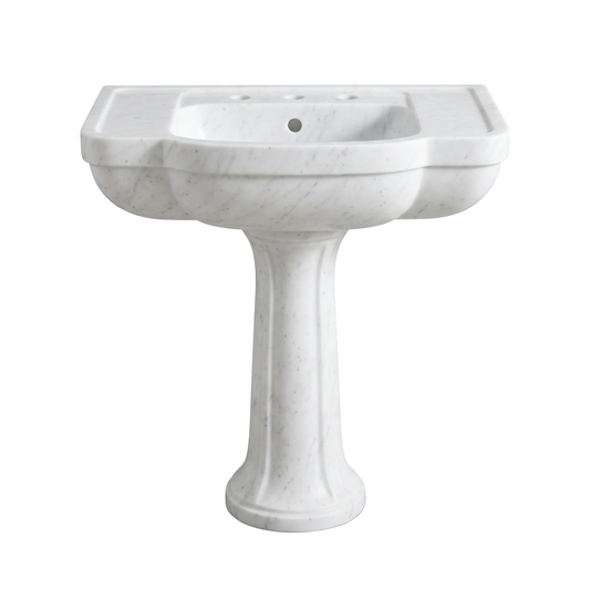 Lorenzo custom Carrara White marble pedestal bathroom sink with sculpted curved apron, tapered pedestal base, integrated side deck grooves, three faucet holes and overflow