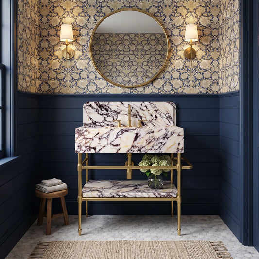 Monument 30 inch Calacatta Viola marble bathroom vanity with sink and solid brass console legs in a luxury bathroom