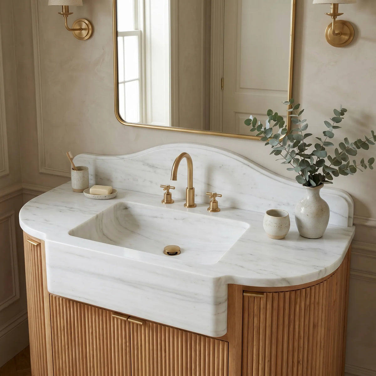 Norbourne custom marble bathroom vanity in Carrara White with integrated sink, scalloped backsplash and fluted oak cabinet