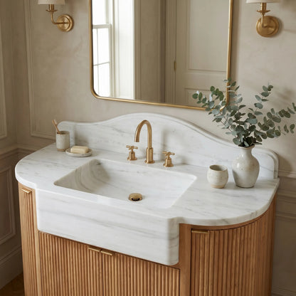 Norbourne custom marble bathroom vanity in Carrara White with integrated sink, scalloped backsplash and fluted oak cabinet