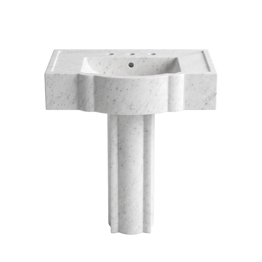 Orvello custom Carrara White marble pedestal bathroom sink with sculpted curved front apron, fluted pedestal, three faucet holes, overflow and recessed side deck details