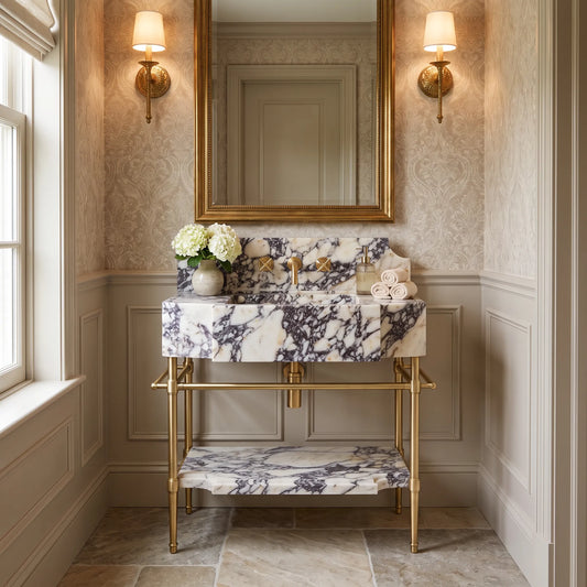 Riviera 30 inch Calacatta Viola marble bathroom vanity with sink and solid brass console legs in a luxury bathroom