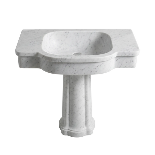 Valdoro custom Carrara White marble pedestal bathroom sink with integrated basin, curved sculpted apron and architectural pedestal base