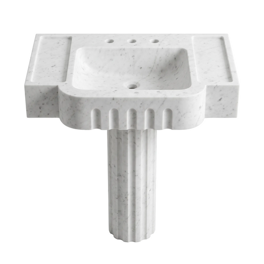Valerio custom Carrara White marble pedestal bathroom sink with fluted front, integrated carved basin, side deck areas and sculpted fluted pedestal