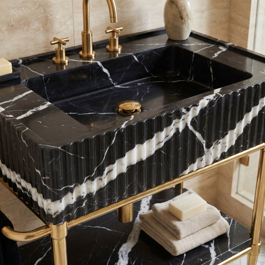 Valmont 30 inch Nero Marquina marble bathroom vanity with sink and solid brass console legs in a luxury bathroom